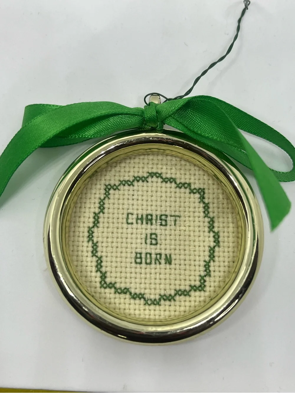 Hand Crafted Christ Is Born Cross-Stitched Holiday Ornament with Green Ribbon